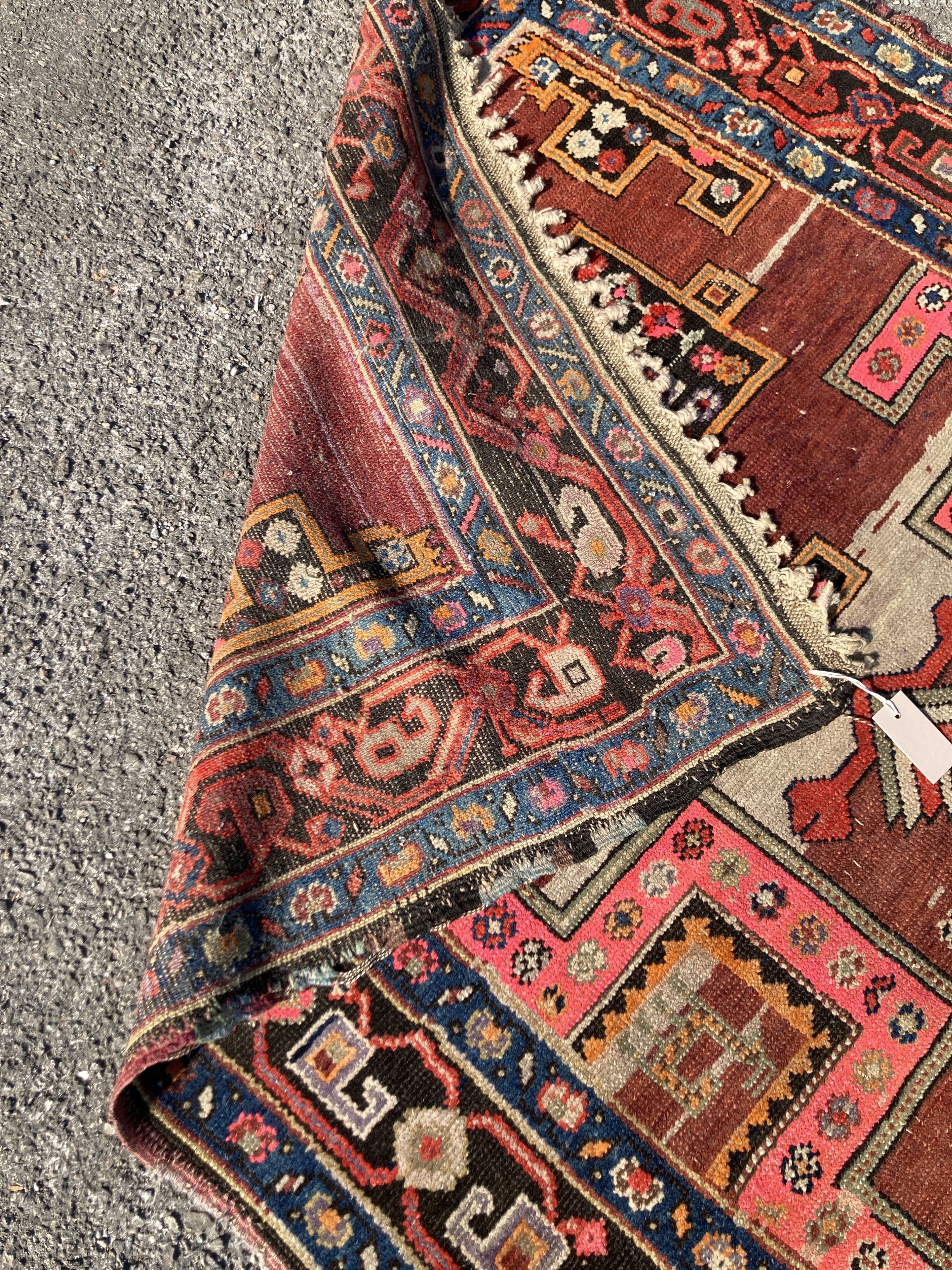 An early 20th century Caucasian Kazak hall carpet, 370 x 128cm